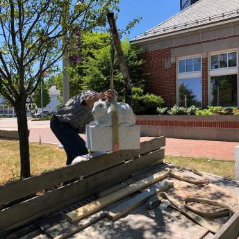 Thomas Berger, the sculptor, begins to install sculpture.